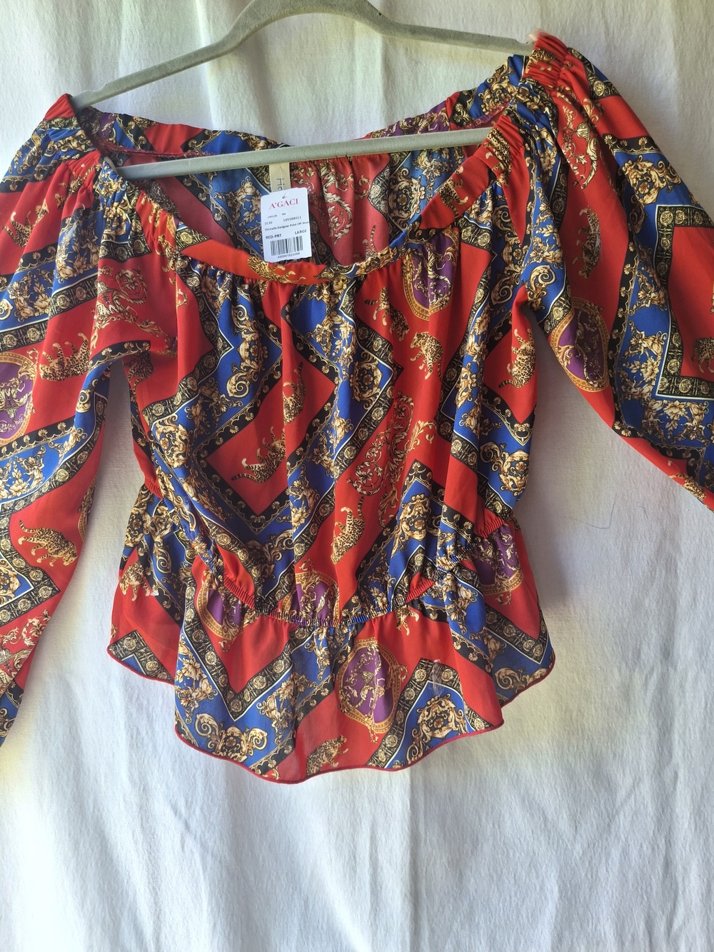 hello miss Red Printed Off-Shoulder Blouse with Blue and Purple Accents.